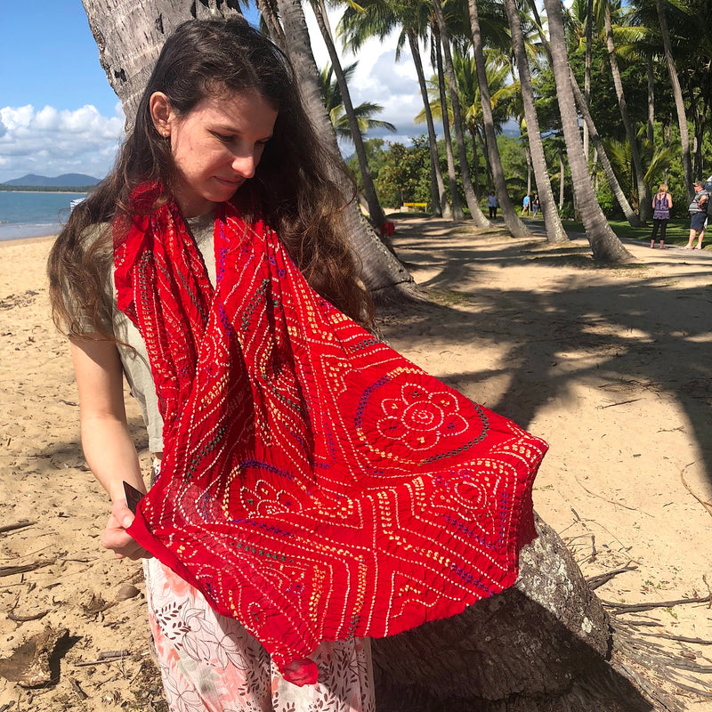 Red silk tied dyed scarf at the beach - Pallu Design